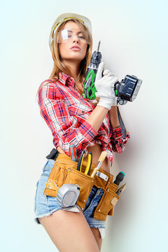 female builder with drill