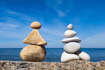 Two figures of white and yellow stones. stones balance. Rock zen