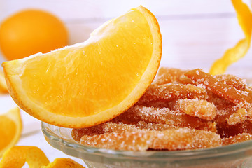 Fototapeta na wymiar Homemade candied orange peels in glass bowl