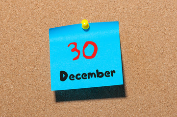 December 30th. Day 30 of month, Calendar on cork notice board. New year at work concept. Winter time. Empty space for text