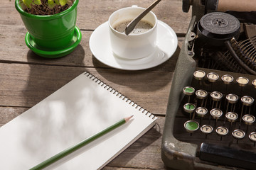 Vintage typewriter on the old wooden desk
