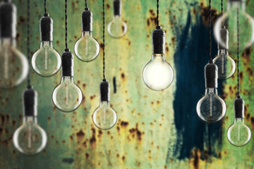 Idea and leadership concept Vintage incandescent Edison bulbs on