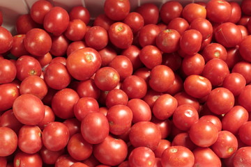 Red tomatoes, background.