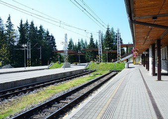 Empty platforms without trains and people at terminal railway station Strbske pleso in High Tatras, Slovakia.