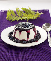 Sweet pudding with blueberry confiture