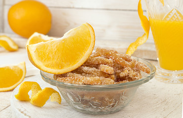 Homemade candied orange peels in glass bowl