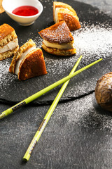 Traditional Japanese sweet dessert consisting of pancakes and biscuits, close chopsticks

