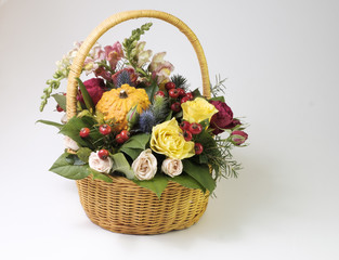 Fototapeta na wymiar basket with flowers on a white background