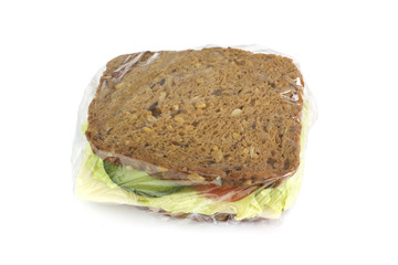 Sandwich packed with stretch film isolated on white background.