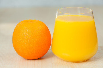Delicious fresh squeezed Orange juice in  transparent glass