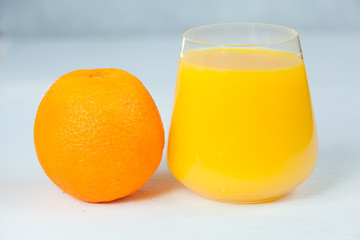 Delicious fresh squeezed Orange juice in  transparent glass