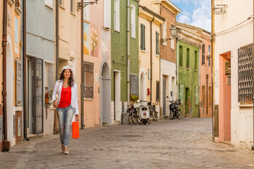 woman walking in a fishing village