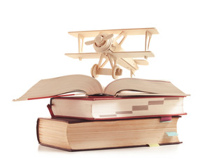 toy plane on the book