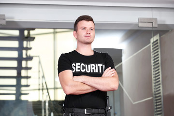 Fototapeta na wymiar Security man standing beside stairs