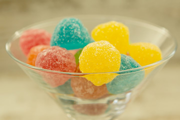 Many jellybeans close up in glass jar