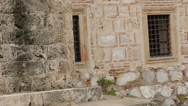 Architecture of Bali beg mosque by the day 4K 2160p 30fps UltraHD tilting footage - Facade and windows of ottoman building located in city of Nis Eastern Serbia Balkan slow tilt 3840X2160 UHD video 