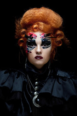 Gothic redhair witch. Dark woman. Halloween picture.