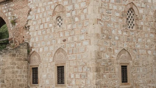 Old architecture of Bali beg mosque by the day 4K 2160p 30fps UltraHD tilting footage - Facade and windows of ottoman building located in city of Nis Eastern Serbia Balkan tilt 3840X2160 UHD video 