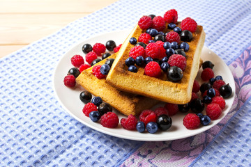Fresh brussels waffle with blueberry, raspberry and blackcurrant