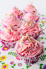 Pink birthday cupcakes  with whipped cream