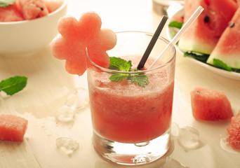 Healthy watermelon smoothie with mint and ice in glass