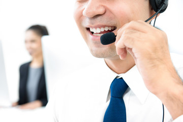 Smiling male call center staff, lower face close up