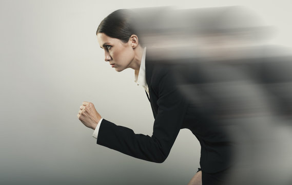 Beautiful young businesswomen passing run isolated