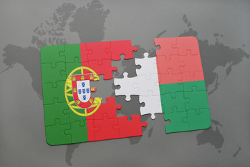 puzzle with the national flag of portugal and madagascar on a world map background.