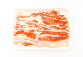 Slide of  raw pork  on white background .