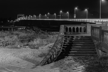 Fototapeta premium Bridge with stairs at night in black and white