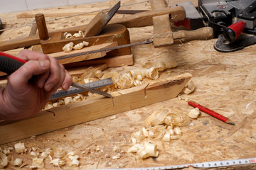 carpenter working,hammer,meter and screw-driver on construction