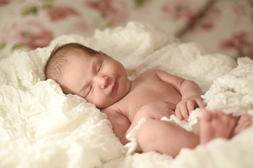 Newborn sweet cute baby girl face sleep