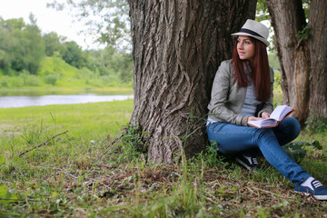 girl with book in park