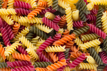 Closeup of raw eco macaroni pasta background.