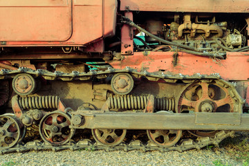 Fototapeta na wymiar Old Mechanical Vehicle Tracks and Engine