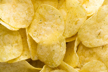 Close up potato chips on top view background.