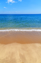 Fototapeta na wymiar Blue ocean background with sandy beach
