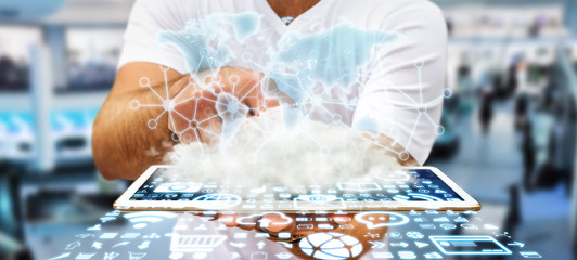 Businessman holding world and cloud © sdecoret