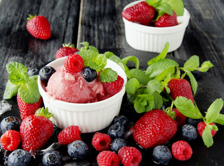 fruit ice cream with fresh strawberries, blueberries and raspberries