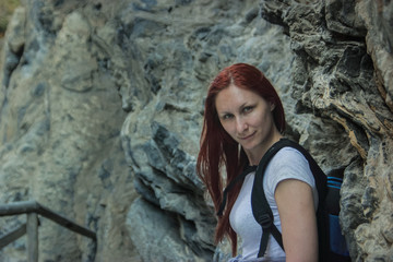 Young beautiful woman outdoor camping standing near Rock in Samaria, Crete