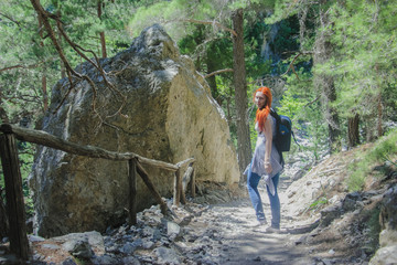 Young beautiful woman walking in Samaria, Crete, outdoor camping