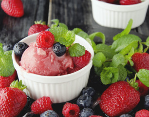 fruit ice cream with fresh strawberries, blueberries and raspberries
