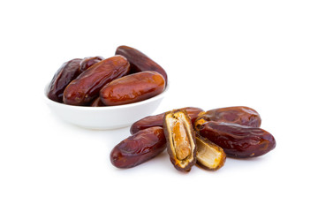 Sweet and healthy dates isolated on white background.