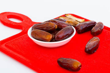 Sweet and healthy dates isolated on white background.