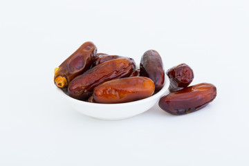 Sweet and healthy dates isolated on white background.