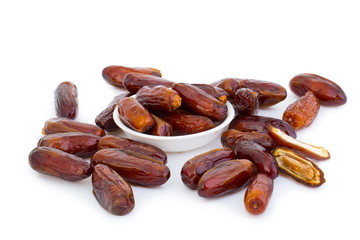 Sweet and healthy dates isolated on white background.