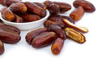 Sweet and healthy dates isolated on white background.