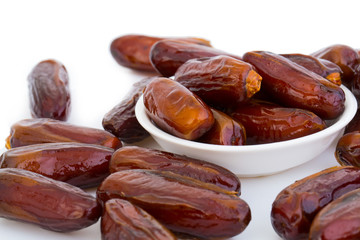 Sweet and healthy dates isolated on white background.