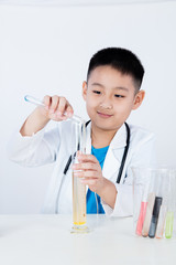 Asian Chinese boy holding test tube for research