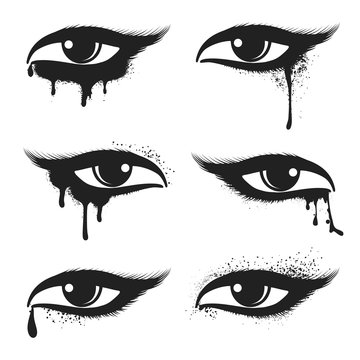 Isolated eyes with black drops and smudges vector